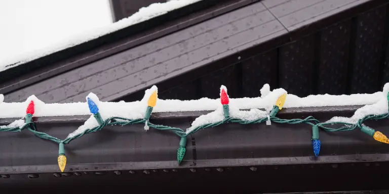 How to Hang Up Christmas Lights Without Damaging Your Roof or Gutters